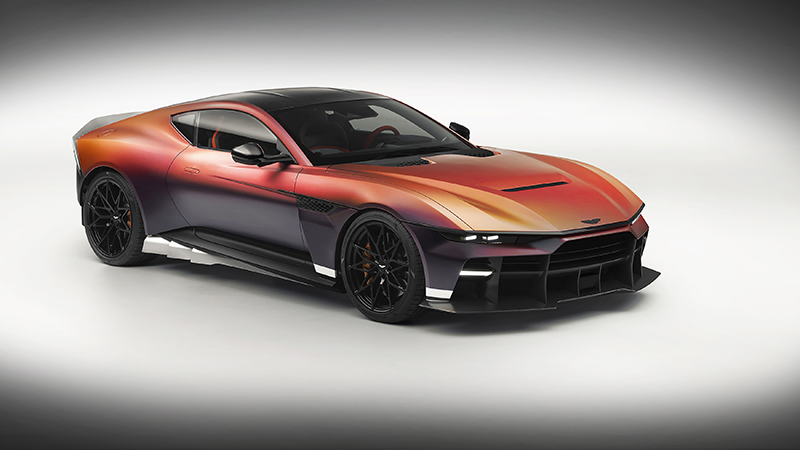 Aston Martin Valour vue de trois-quarts face avec peinture dégradée orange, violette et noire sur fond blanc